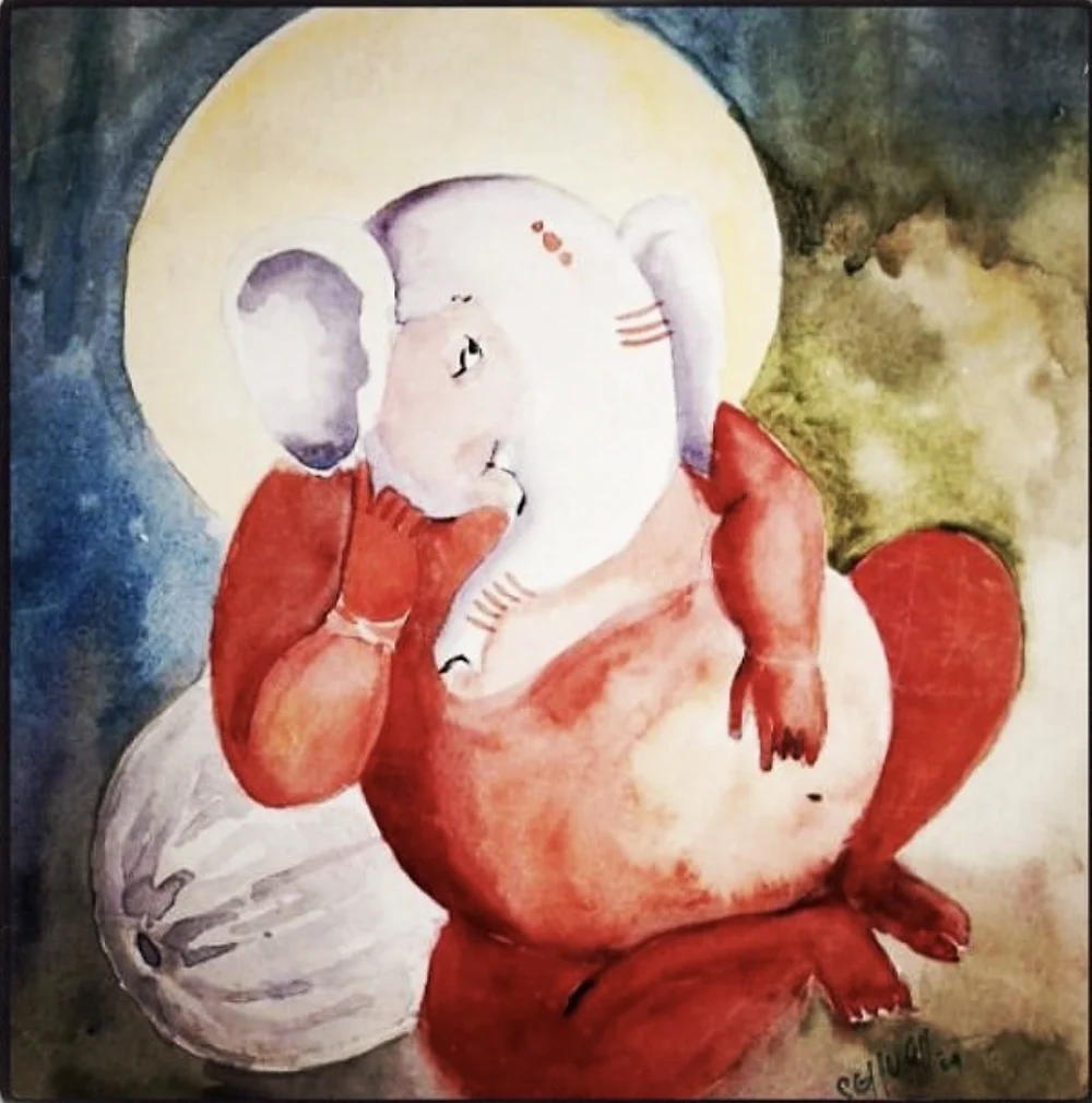 A watercolour of a soft white and red Ganesha against a blue and green wash