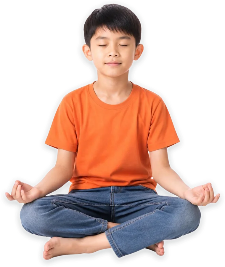 A boy meditating cross-legged with his eyes closed