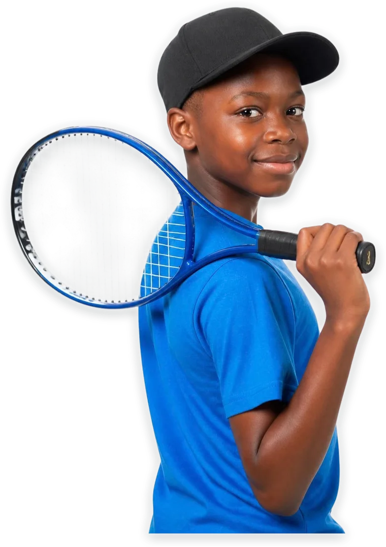 A boy in a cap with a tennis racket over his shoulder